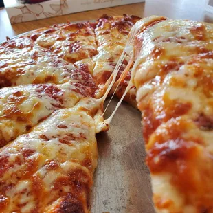 That pizza cheese pull.