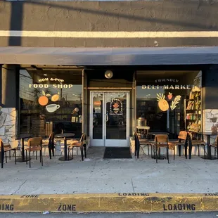 The storefront with a yellow loading curb for grab-and-go