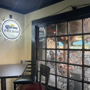 a table and chairs in front of a window