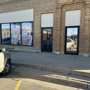 a car parked in front of a restaurant