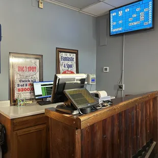 a cash counter with a laptop on it