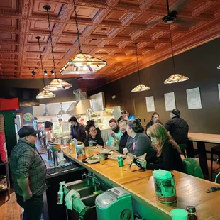 a group of people sitting at a counter