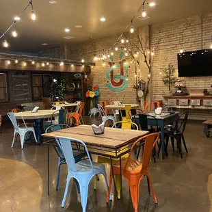 a dining area with tables and chairs