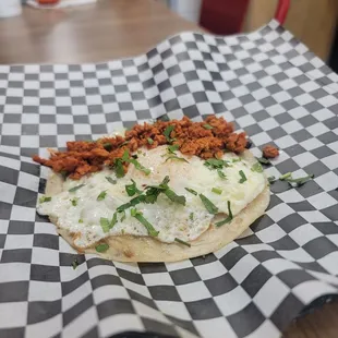 a taqueria with a fried egg on top