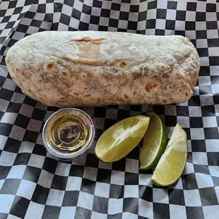 a burrito and lime wedges