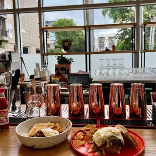 a plate of food and a bowl of chips