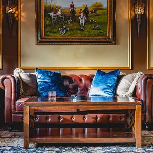 a leather couch and leather chairs