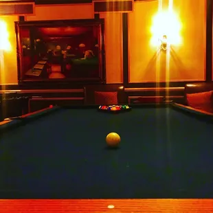 a pool table with a ball on it
