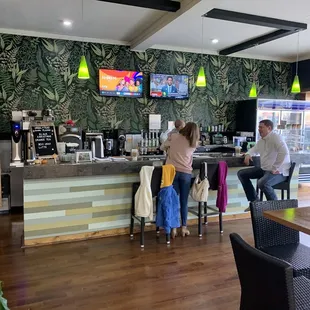 two people sitting at the bar
