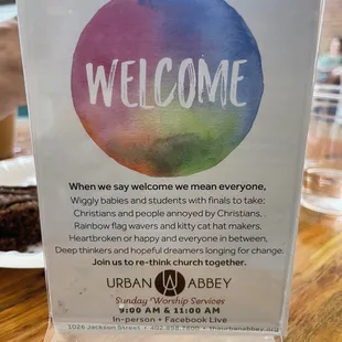 a welcome sign on a table