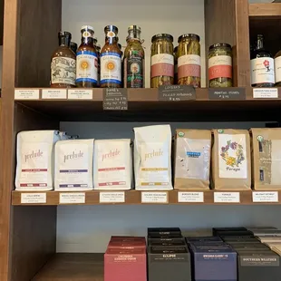 a shelf full of coffee and teas