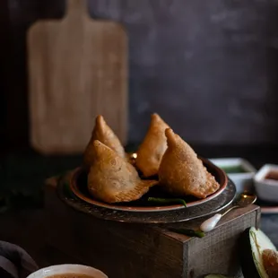 a plate of saman and a cup of tea