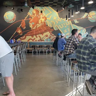 a group of people sitting at tables