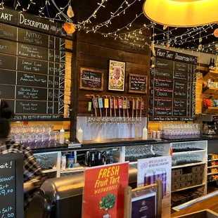 a bar with menus on the wall