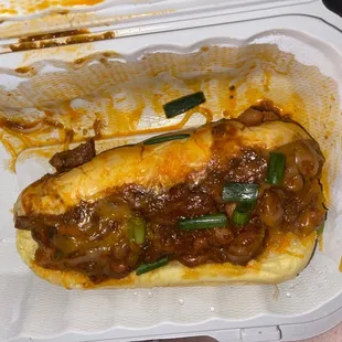 ows a sandwich in a styrofoam container