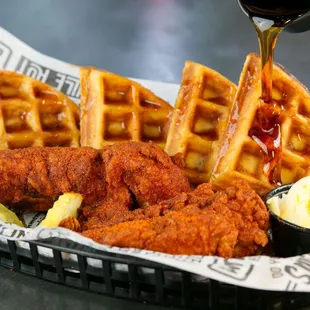 a basket of fried chicken and waffles