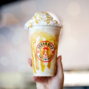  hand holding a cup of ice cream