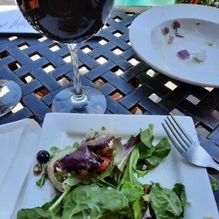 The insalata with berries and gorgonzola crumbles, and the Capo Italian Cab.