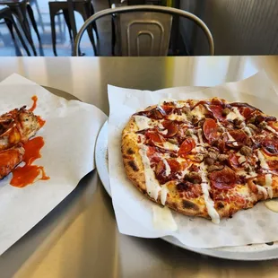 two pizzas on a table