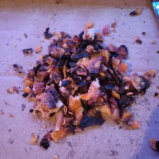 Thats not bacon, that is dorito chips scraped off the pizza
