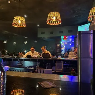 people sitting at a bar