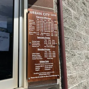 a menu on the outside of a building