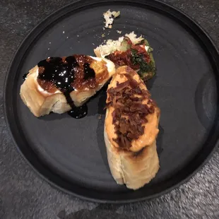 "Bruschetta" the red piece was literally inedible. No exaggeration. We spit it out.