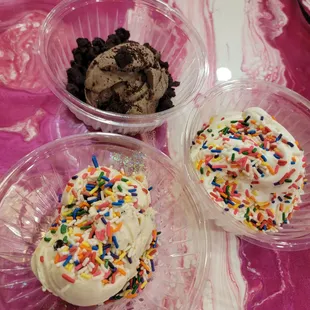 Chocolate ice cream with brownies.  Vanilla ice crean with sprinkles.