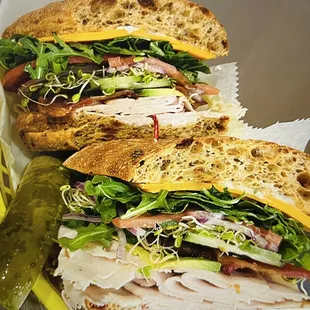 a turkey sandwich and pickle