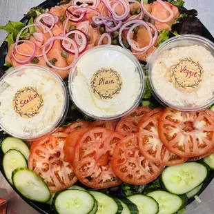 a platter of vegetables and dips