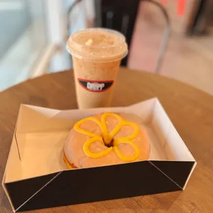  donut and a drink on a table