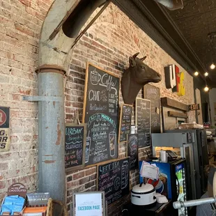 a horse head mounted on a brick wall