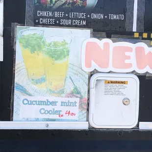 a menu on the side of a food truck