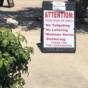 a sign on a sidewalk