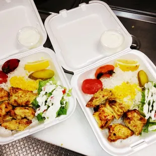two takeout containers of food