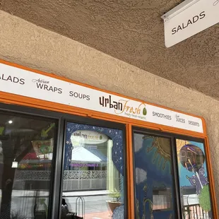 The front of the restaurant with sitting in the patio.