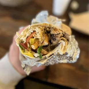 Mashtee wrap (beef, chicken, fries, green, tomatoes, pickles, banana peppers, parsley, onions, special sauce) for $15.99