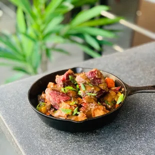 Pot Roast mixed together with potatoes, carrots and onions with a rich mushroom sauce