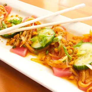 #1 grade ahi, pickled cucumbers, spicy peanuts, spicy sesame soy (contains onions).