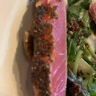 Blackened ahi tuna on top the kale and quinoa salad.