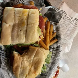 Italian sub with fries, sorry for the bite haha