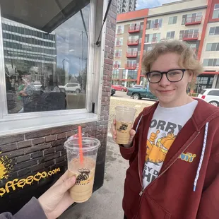 a woman holding a cup of coffee