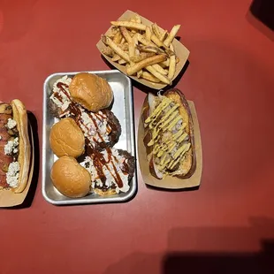 From left to right, Le, blue, hot dog, barbecue sliders, plant-based brat, and Sweet Potato Fries