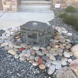 Bubbling boulders/Flagstone are great for small areas.    Urbanlandscapesomaha.com