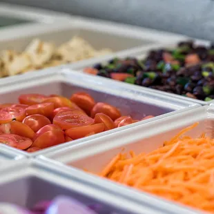 a variety of vegetables in containers