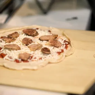 a pizza on a wooden board