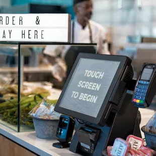 a cash counter with a touch screen