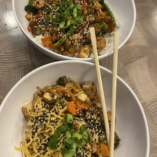 two bowls of asian food with chopsticks