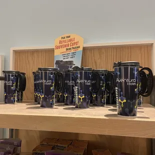 a variety of coffee mugs on a shelf