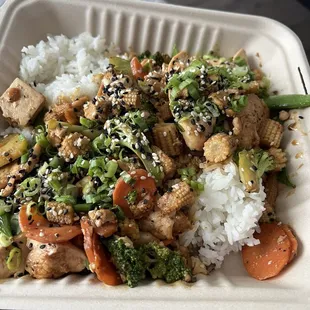 Stir fry with tofu, chicken, 4 veggies (broccoli, carrots, baby corn, and snap peas), with white rice! I asked for light sauce.